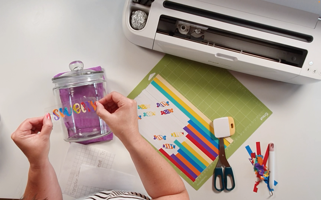 Lining up the word sweets onto the front of the jar