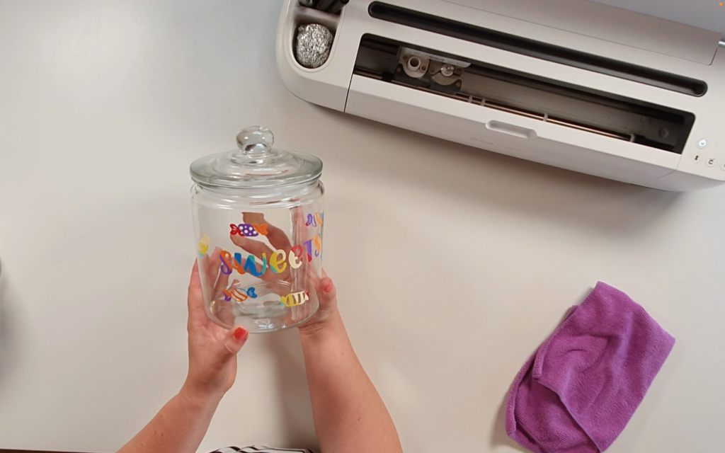 Showing the completed jar with the word sweets and all the sweet designs on the front