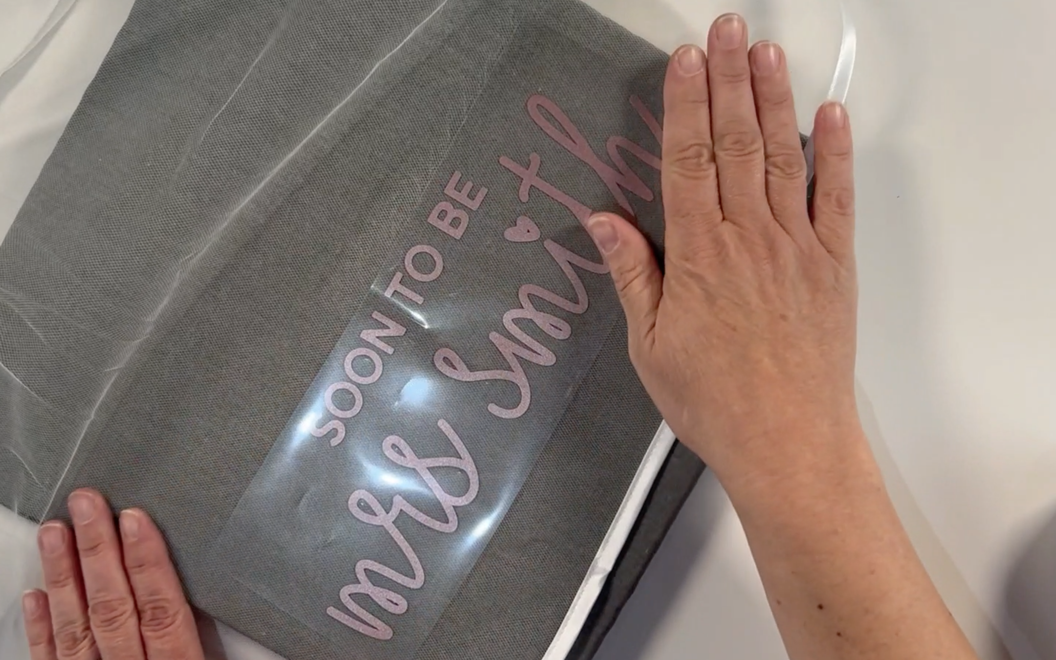 Positioning the weeded design onto the wedding veil