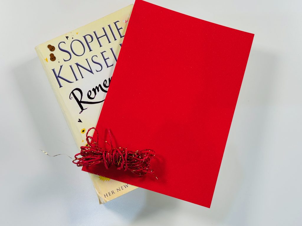 supplies i used to make my banner. A old book, red card and red twine.