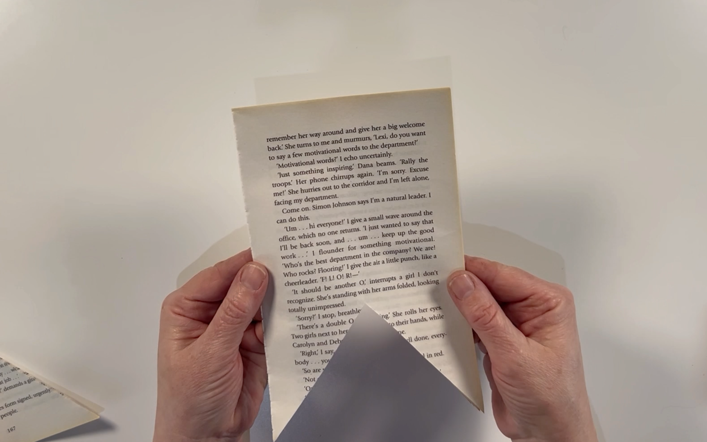 A book page with a triangle cut out the bottom to make the bottom of the flags.
