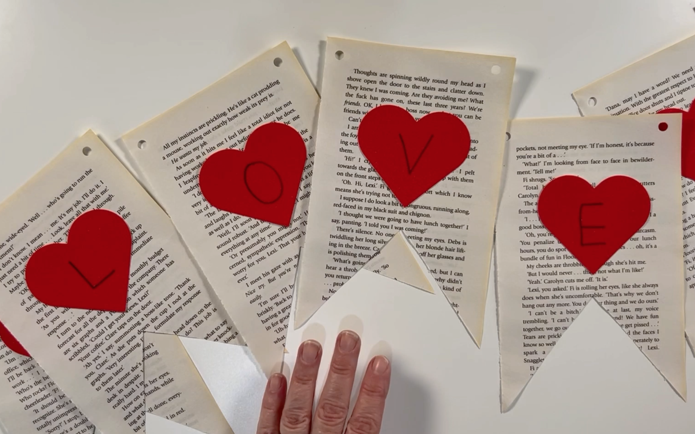 the word love wrote on the red hearts