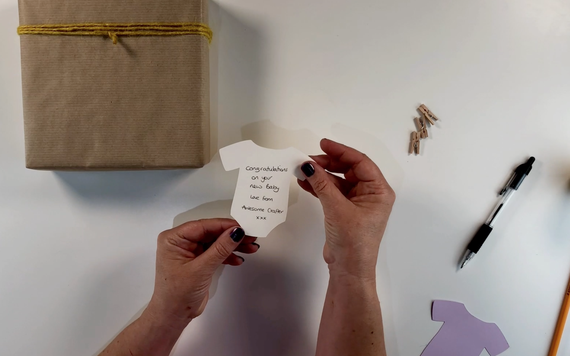 Writing a message on the back of the tag.