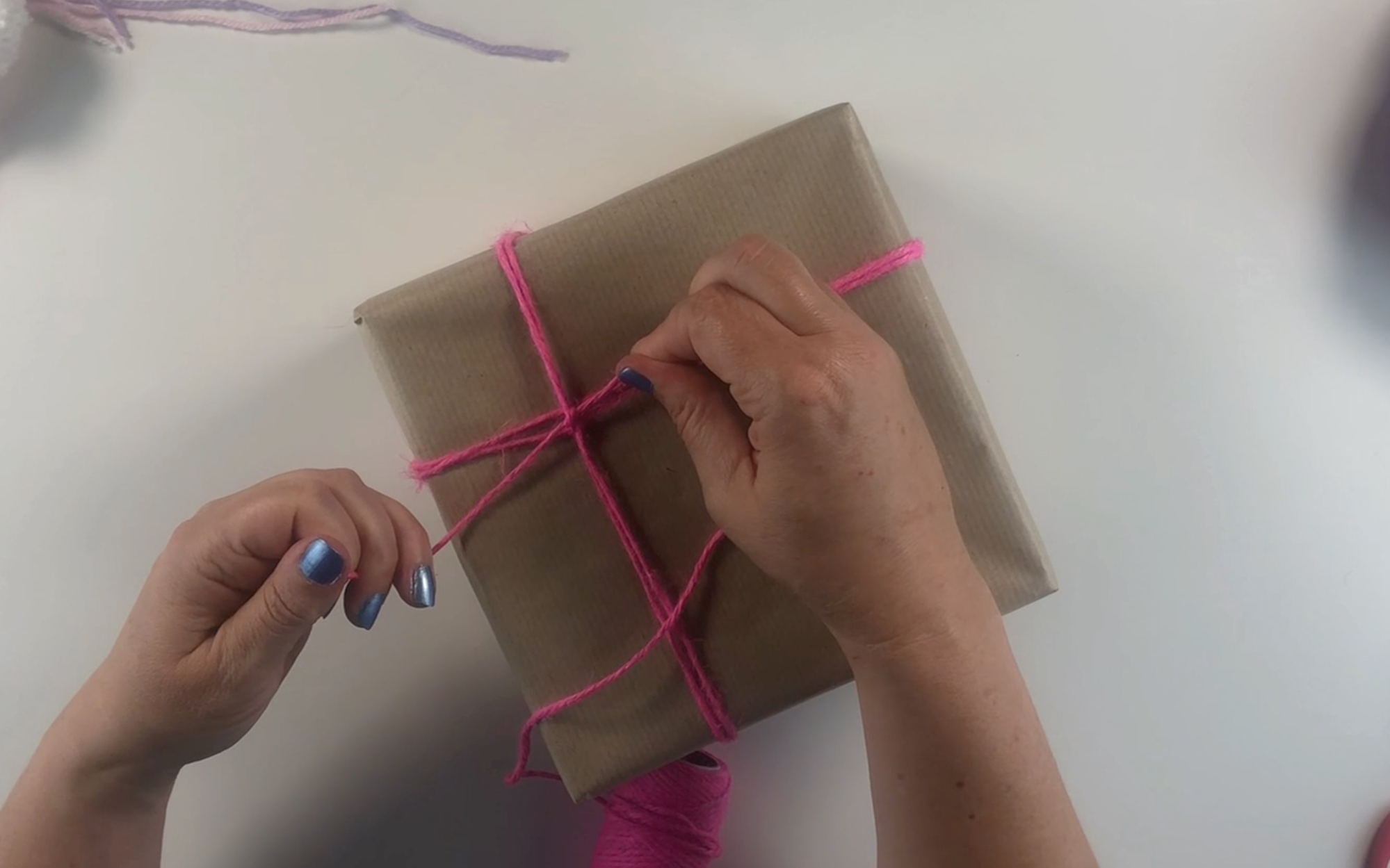 finishing off the twine by tying a knot