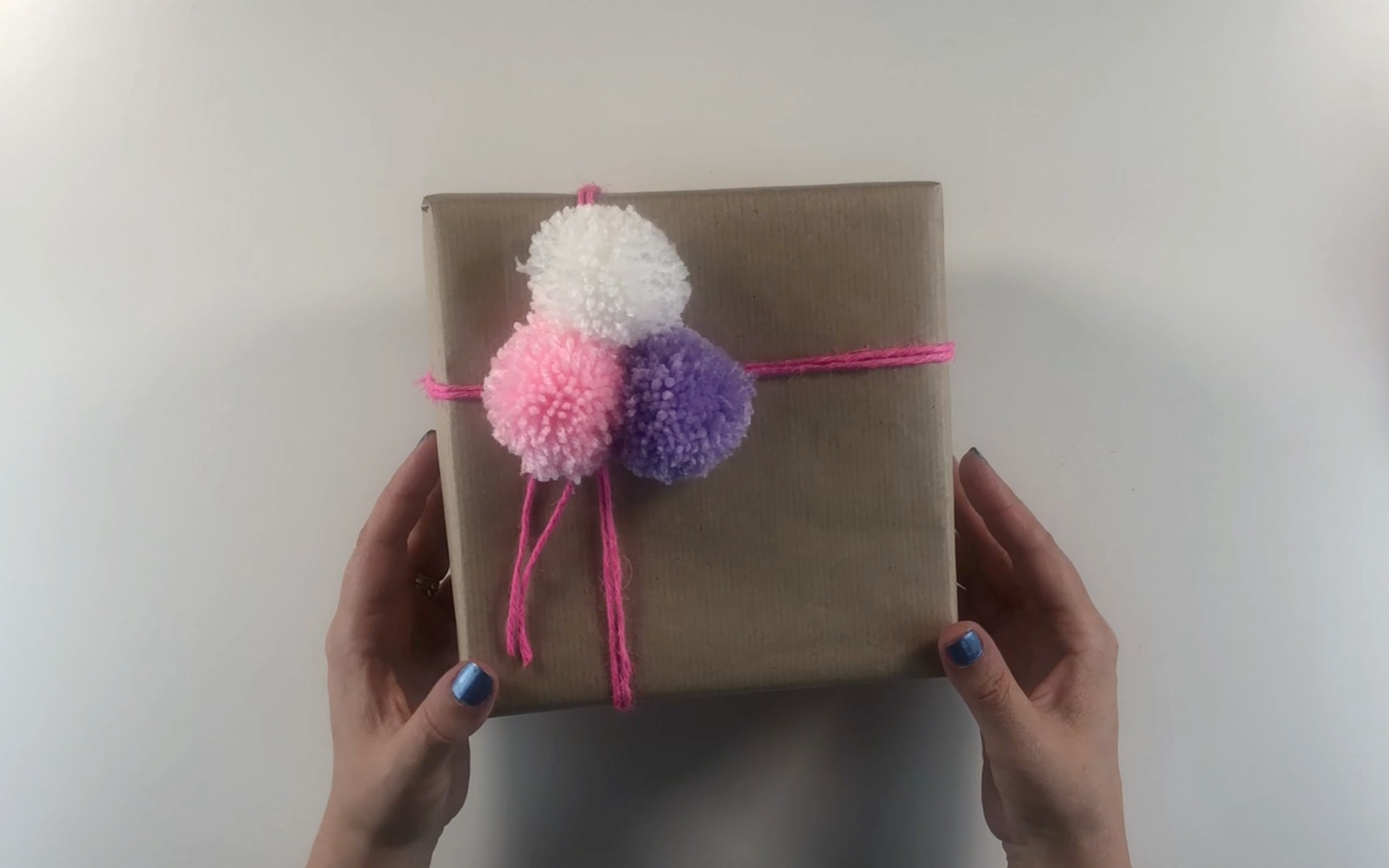 Completed present with added pompoms
