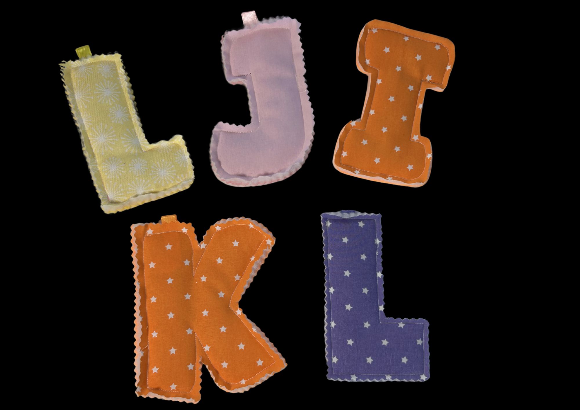 Padded letters Sewn Padded letters L, J, I, K and L.