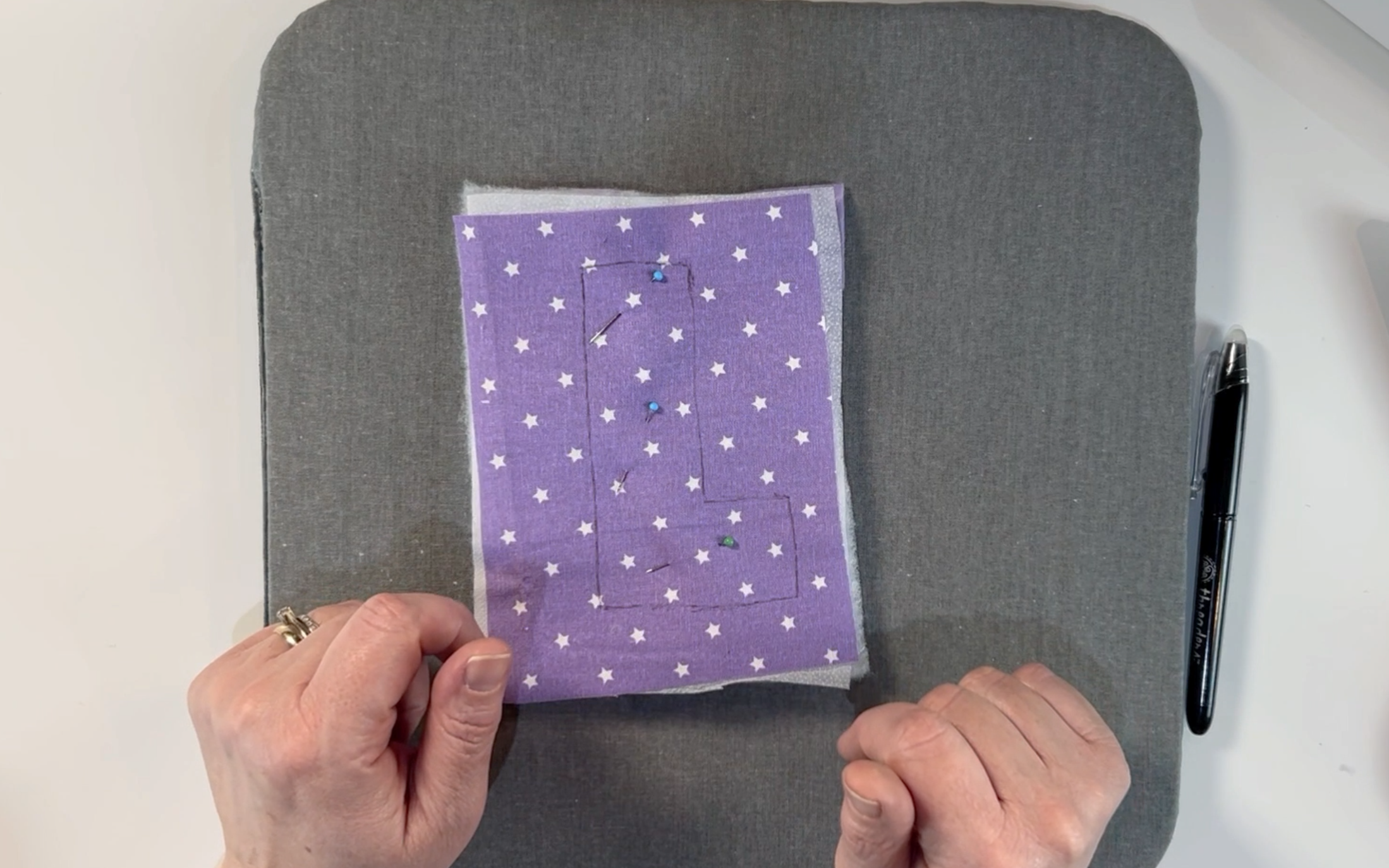 Securing all the layers of material with glass head pins