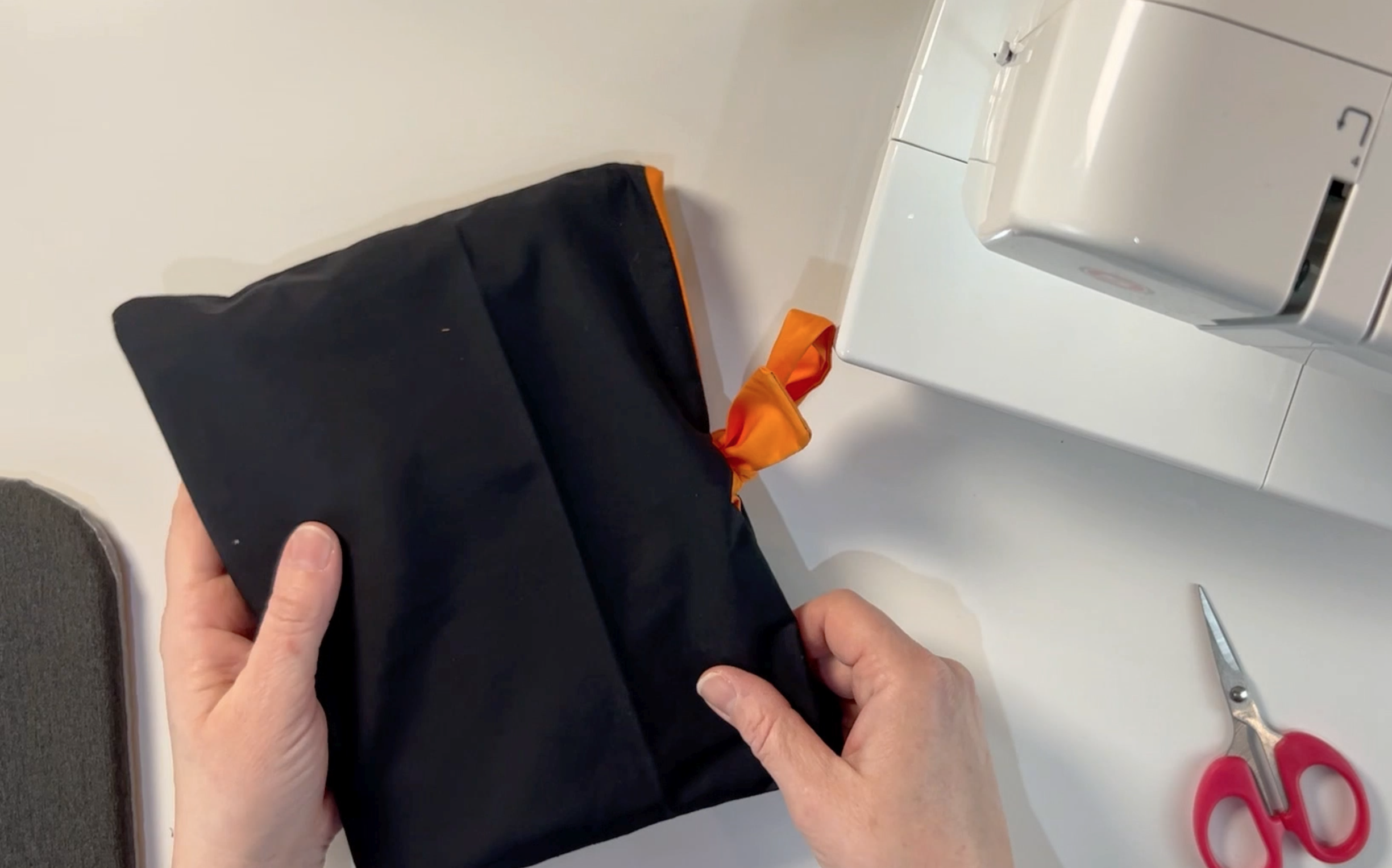 the tired up book pouch with a book inside. 