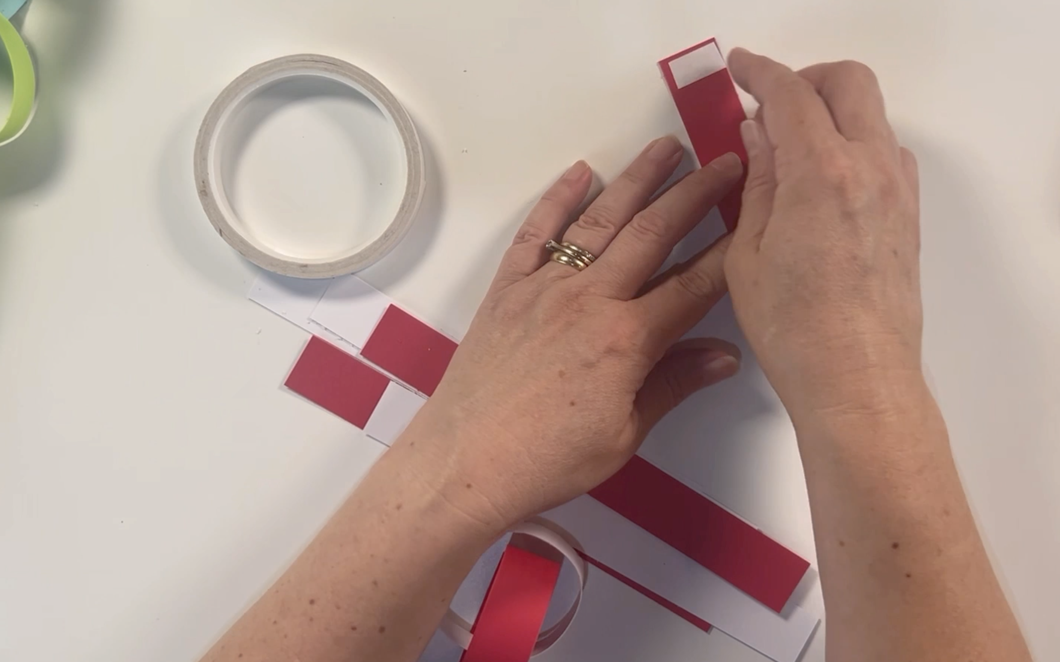Adding double sided tape to a piece of the red card.