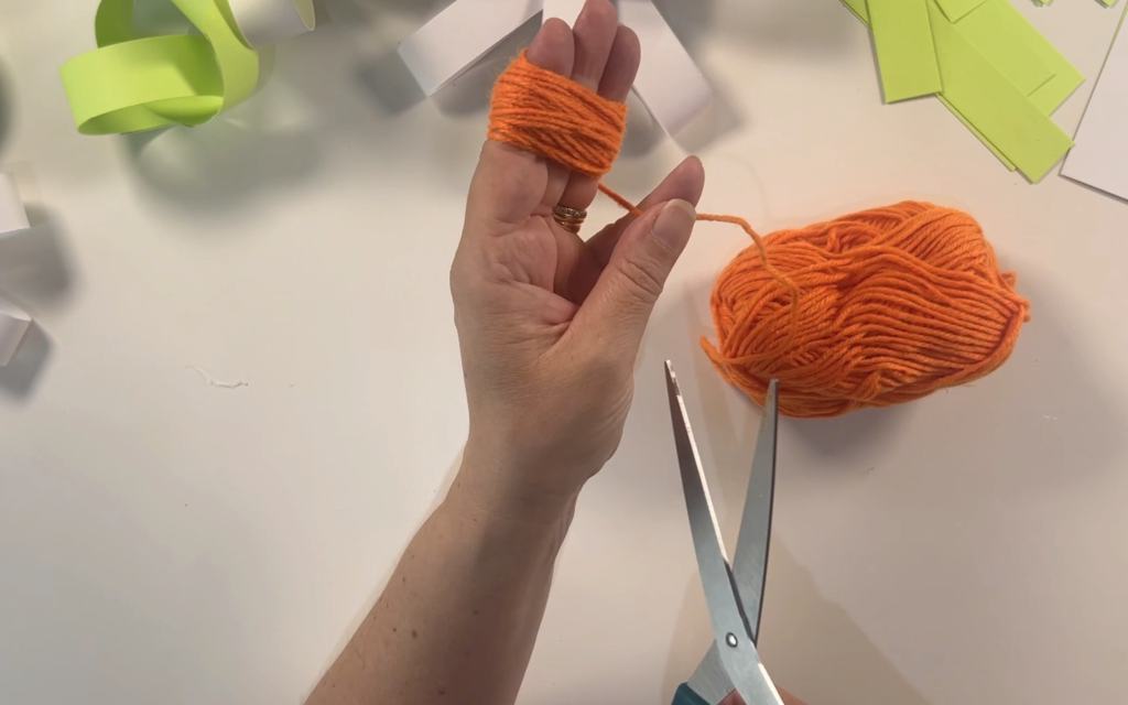 Wrapped orange wool around 3 fingers