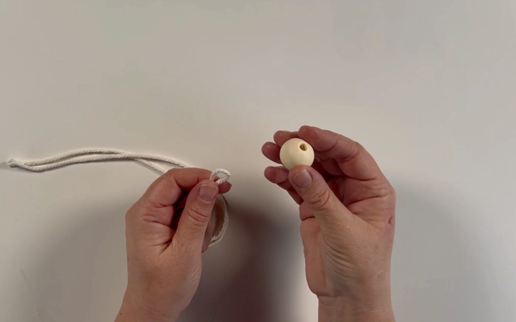 The macrame cord and the wooden bead.