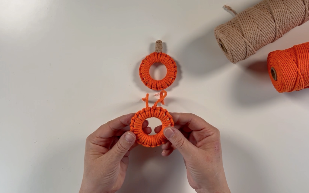 The wooden ring totally covered in macrame cord. 