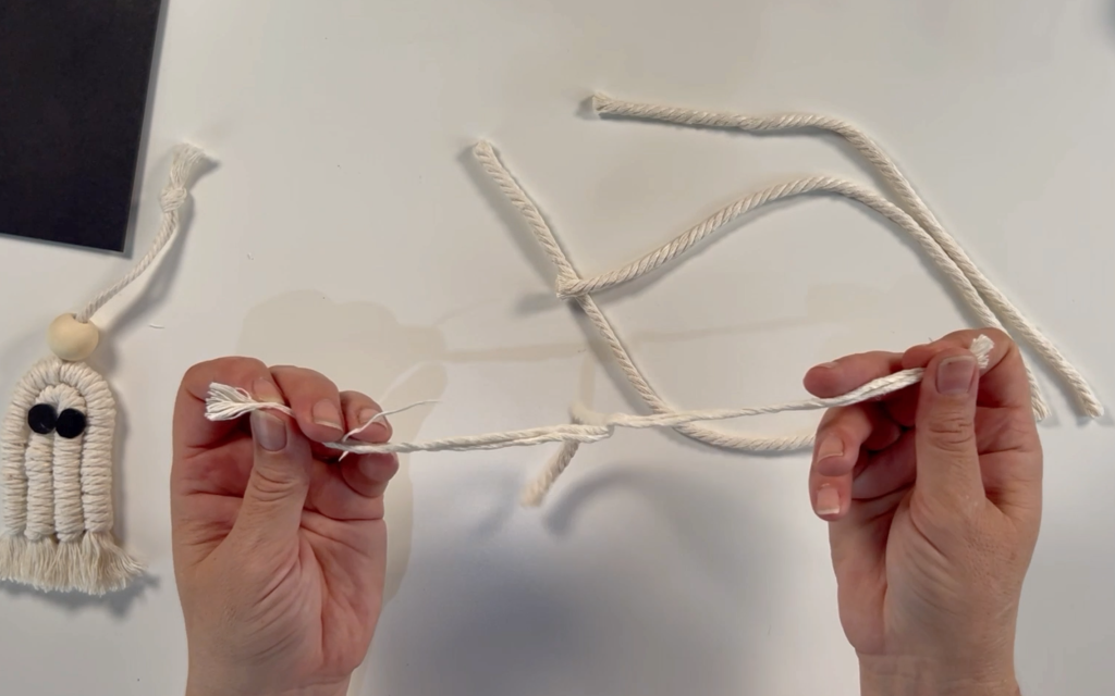 Separating the strands of the macrame cord