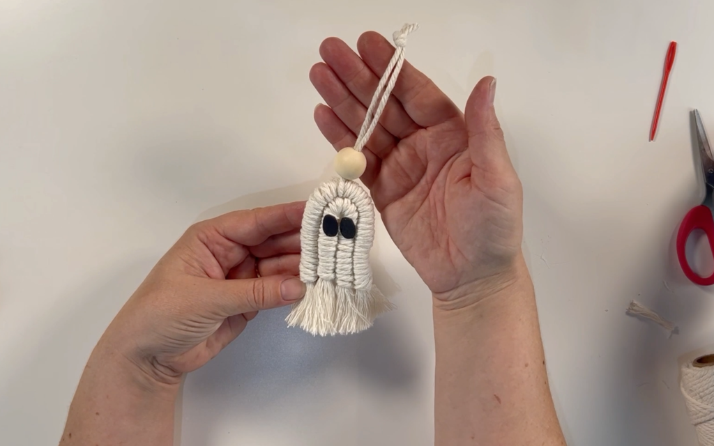The completed macrame ghost ready to be hung. 